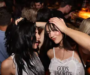 Two girls dancing to house music in Chicago and having fun at West Loop night club Kashmir in Chicago, IL.