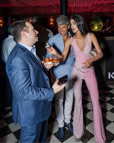 Good looking patrons exchange conversation on the best dance floor in Chicago IL.