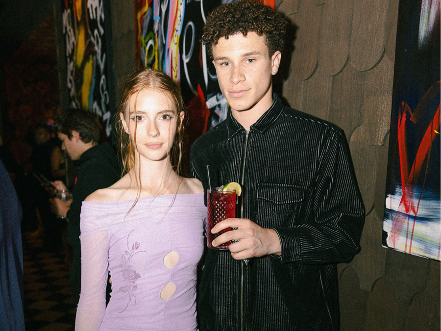 Couple with best cocktails in Chicago posing.